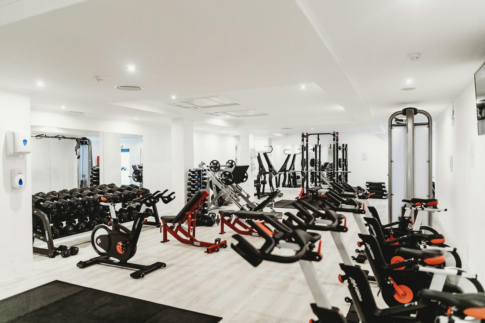 A fully equipped gym floor, spotless and empty in daylight